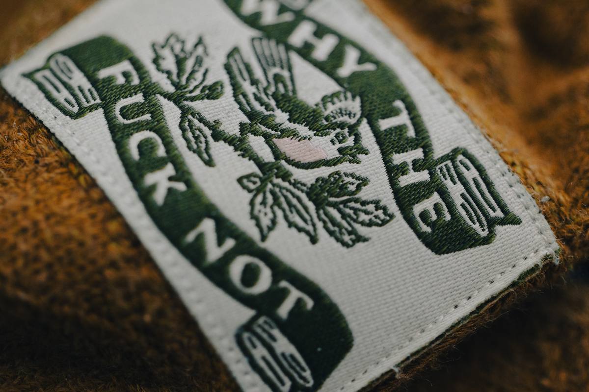 Socks embroidered with “why the fuck not?”